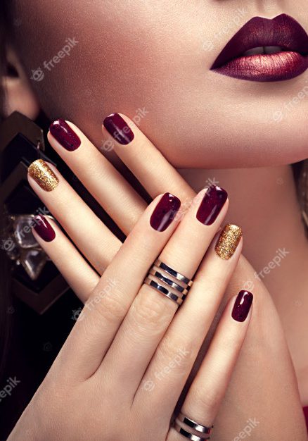 beautiful-woman-with-perfect-make-up-burgundy-golden-manicure_106029-60